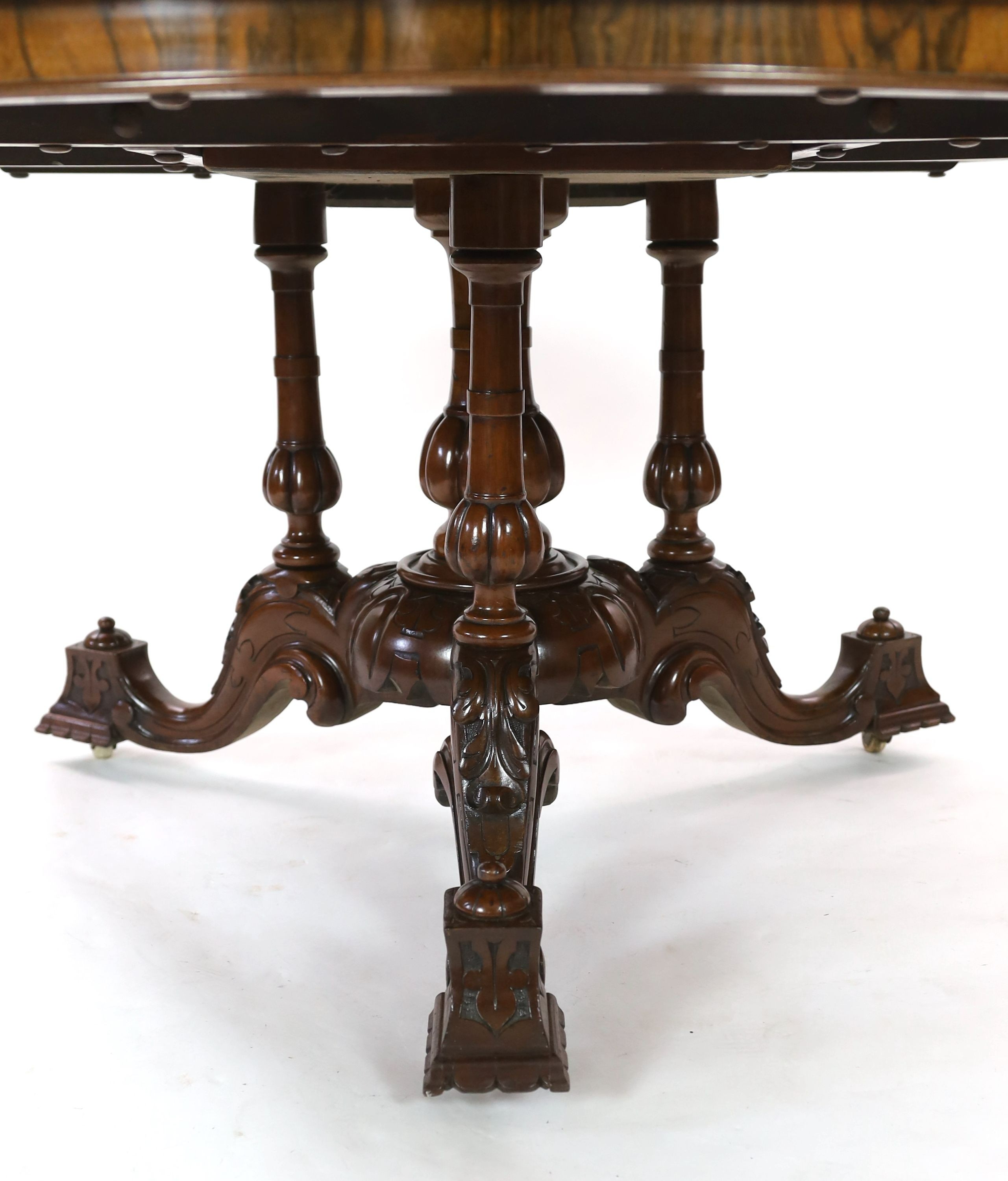 A Victorian walnut and marquetry breakfast table, diameter 144cm H.77cm